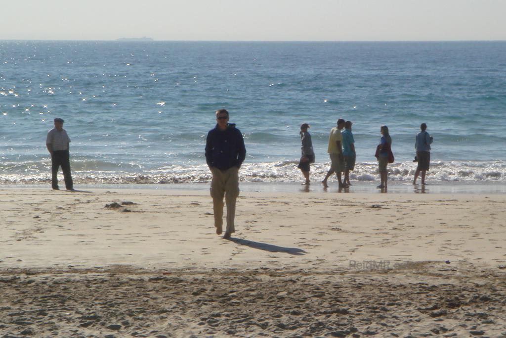 At the beach with the water in the background in Port Elizabeth, South Africa.