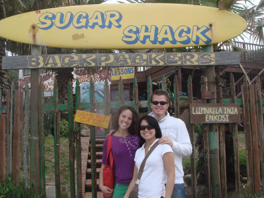 A group of us friends in front of the Sugar Shack sign.