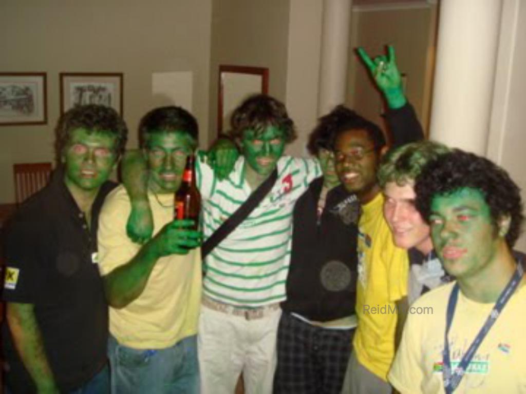 The guys with painted green faces ready to watch the rugby game.