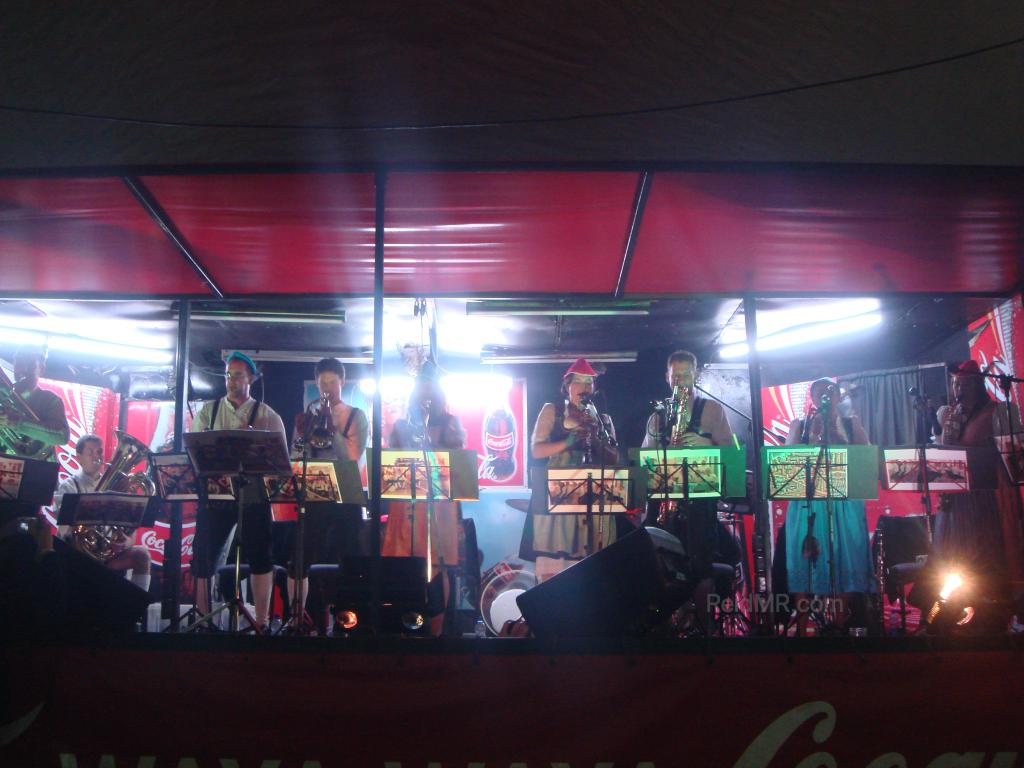 A group of musicians on stage at the Octoberfest festival.