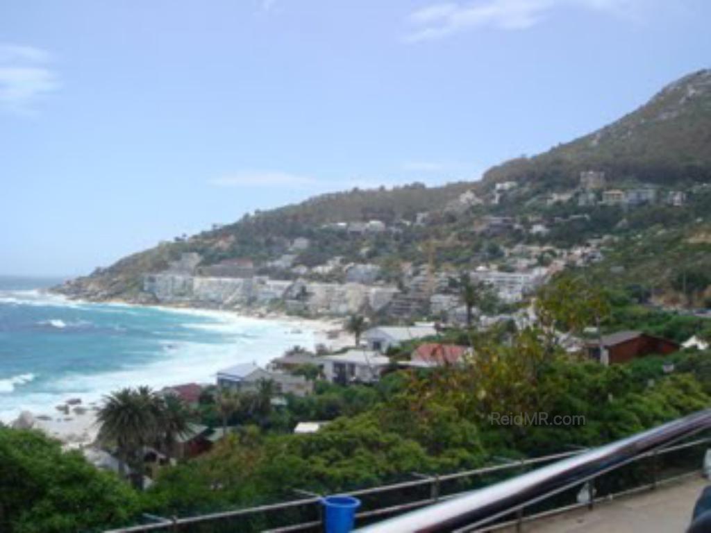 A wealthy area of Cape Town, with the city, mountain and water in the frame.