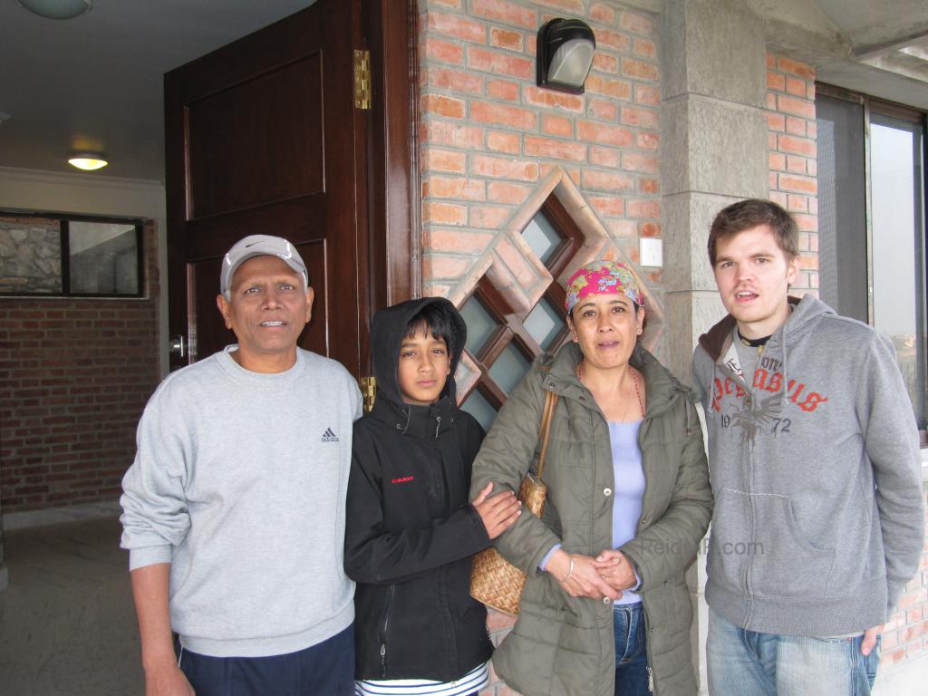 Lexa's family, her stepdad, Ash, her mom and I with the house they are building