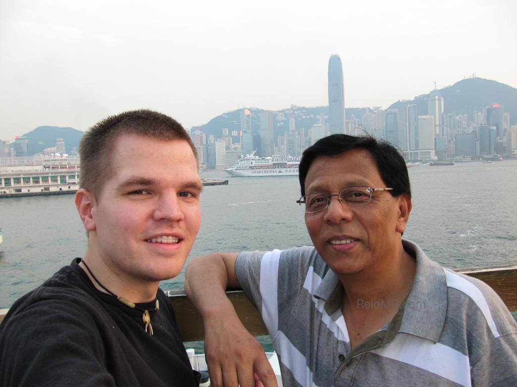 Dad and I by with the city and water in the background. 