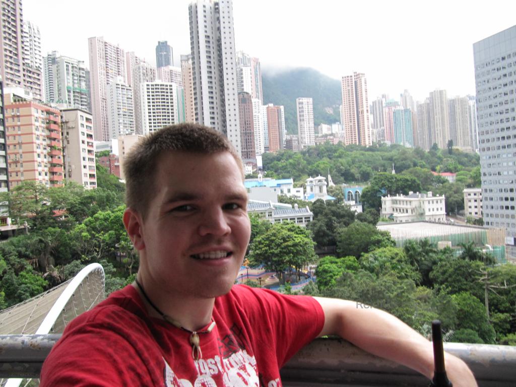 Me with the city in the background, tall sky scrapers.  