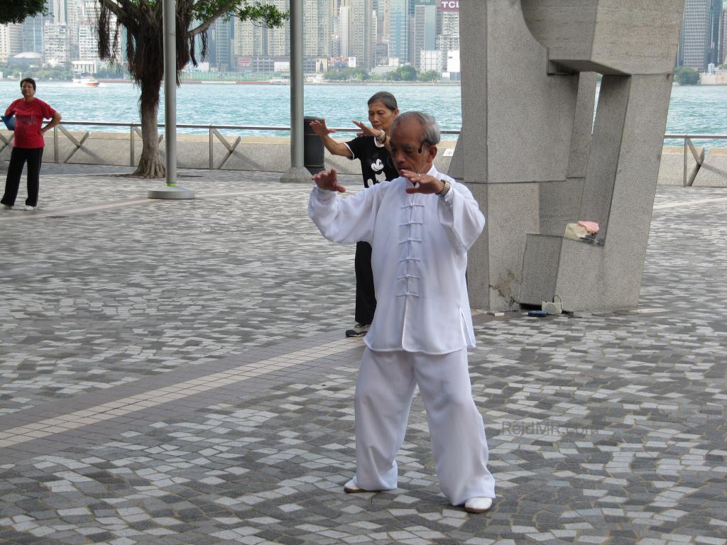 At the waterfront, the Tai Chi teacher in white. 