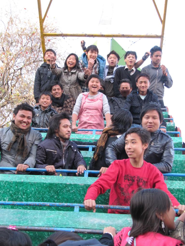 A bunch of people on the Pirate Ship standing up