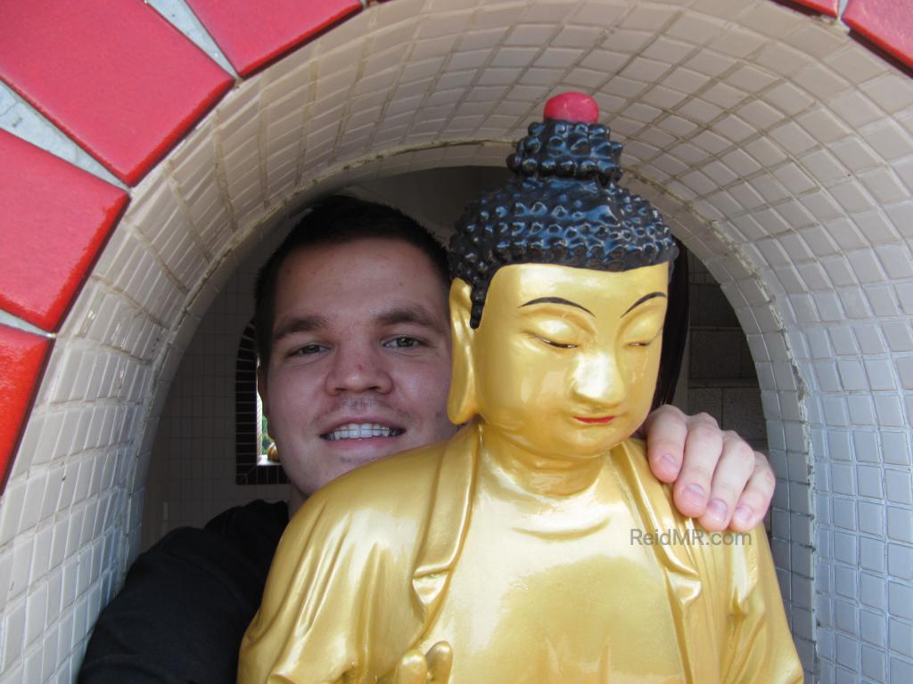 Me hugging a buddhist statute. 