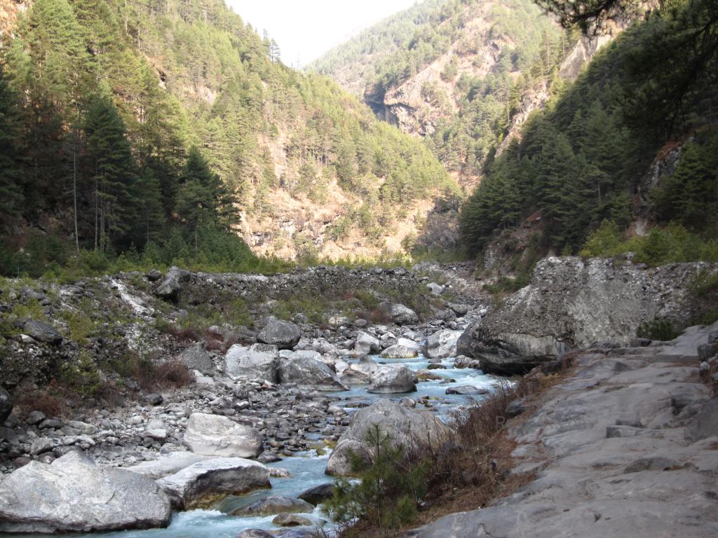 Mountainous landscape with a stream running in the valley