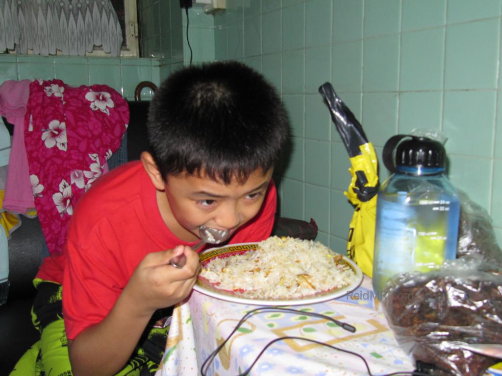 Marv is eating his fried rice, probably the first time he has cooked. 