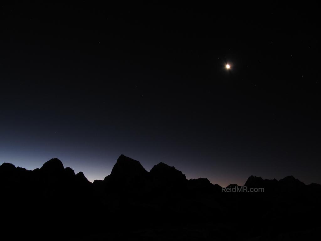 One of my favorite pictures, the moon showing as the sun is starting to show. The full image has stars as well. Himalayan range shown.