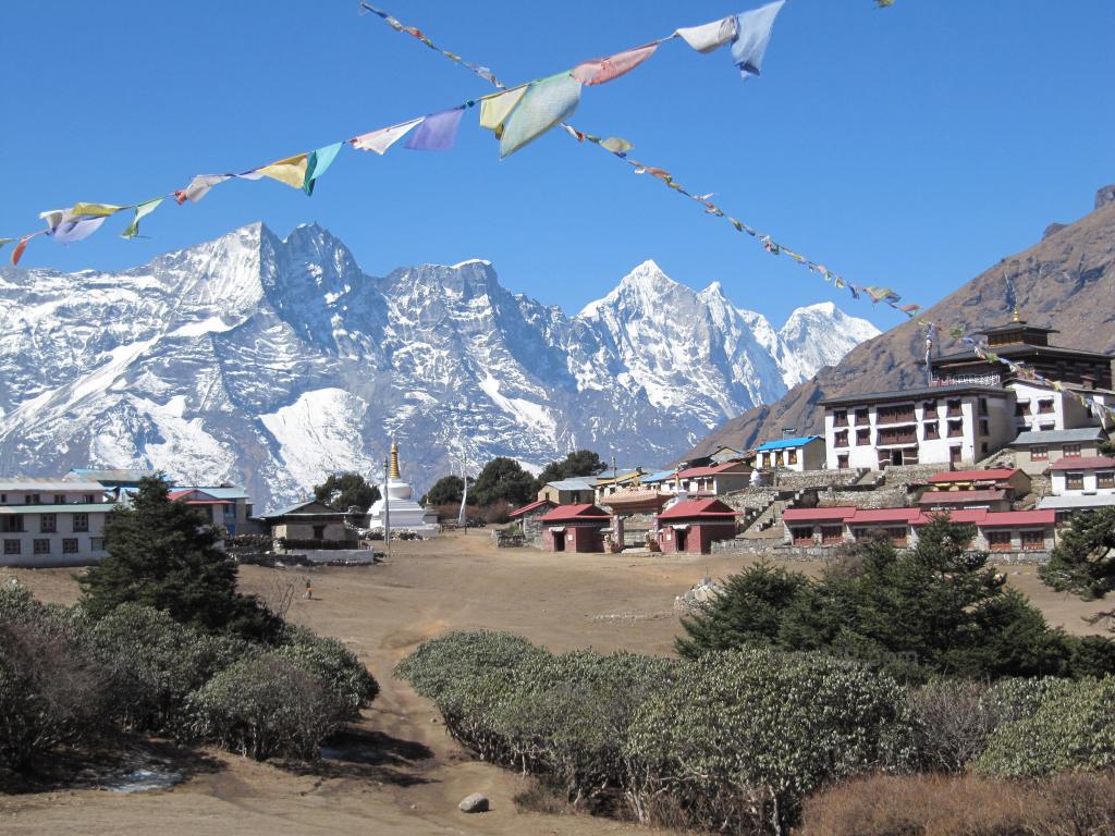 Tengboche Temple, with mountains behind and prayer flags