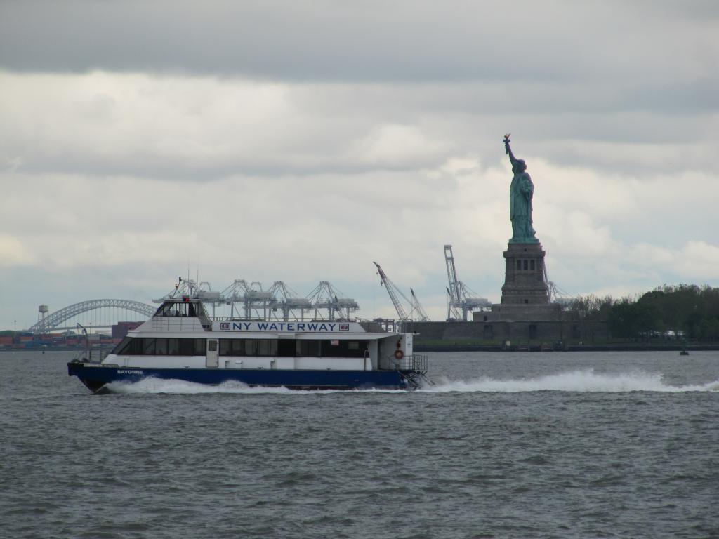 Statue of Liberty with the ferry in front of it