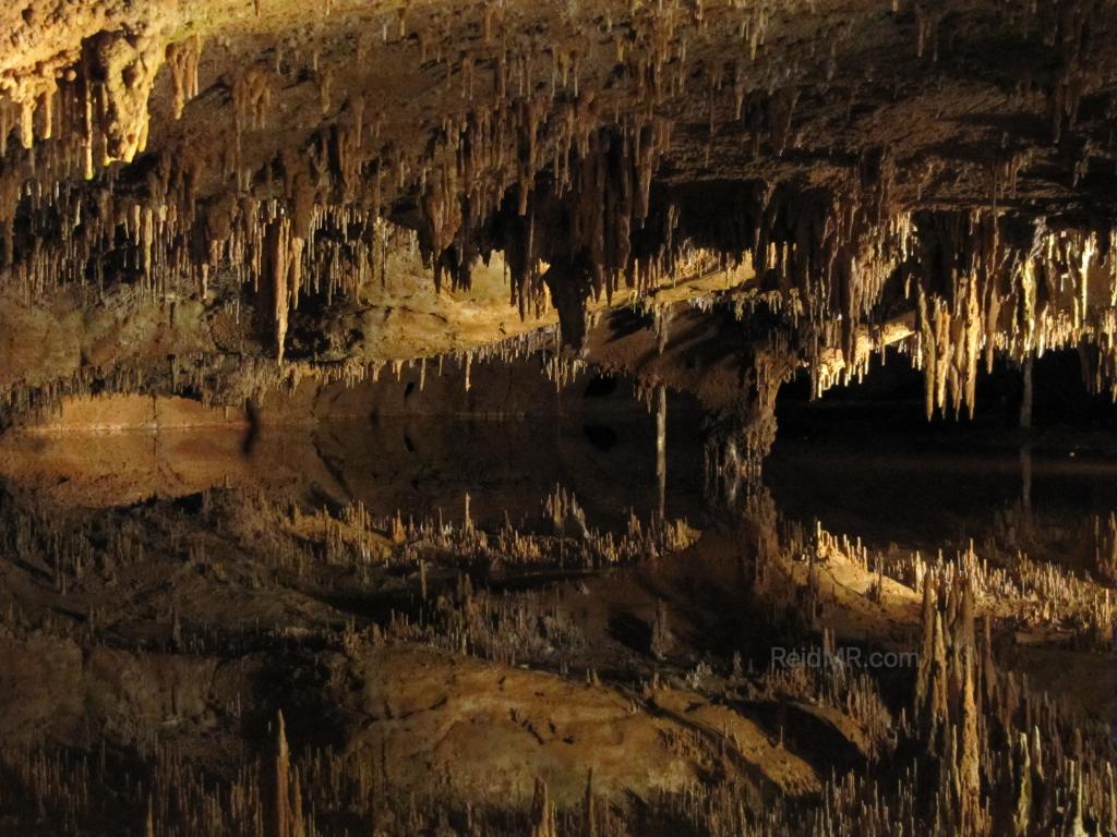 Luray Caverns, a photo of the mirror like water reflecting the top half of the cave