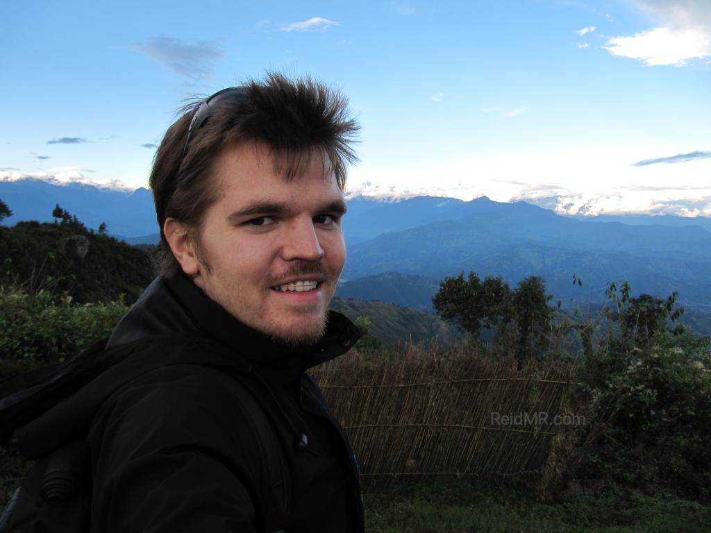 Me with the Himalayan Mountains in the background at Nagarkot