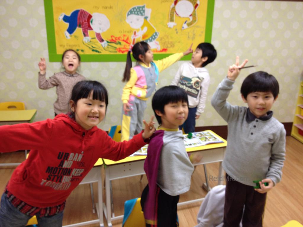 Six of the kinder students posing for a photo