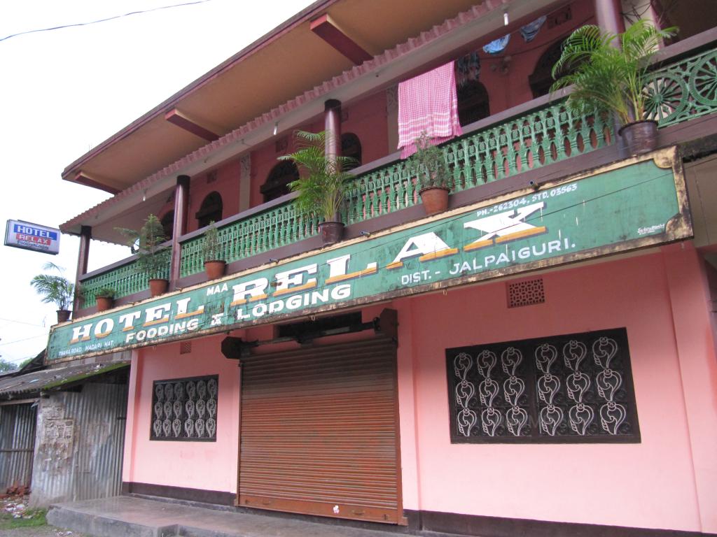 Sign for Hotel Relax, a bit run down building