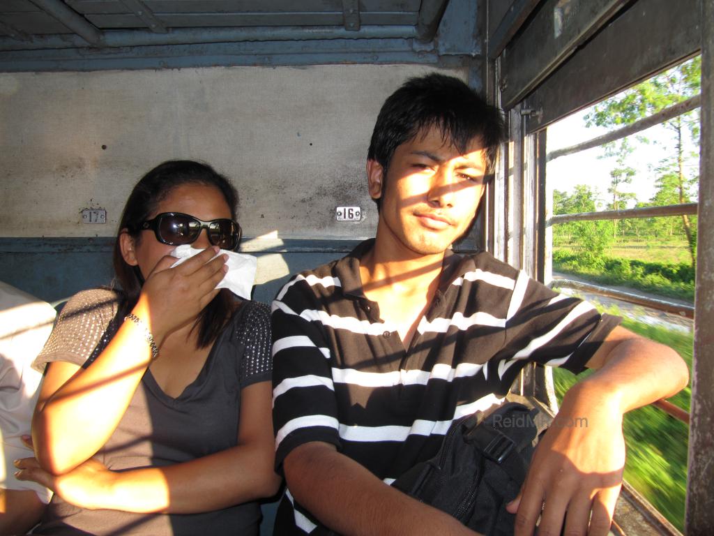 Likee and Rojesh on the Train, Likee covering nose