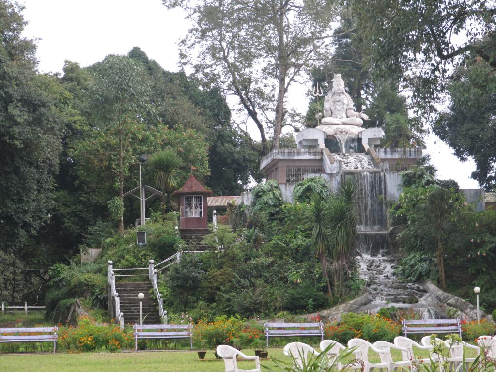 A view of a statue in a park in Darjeeling