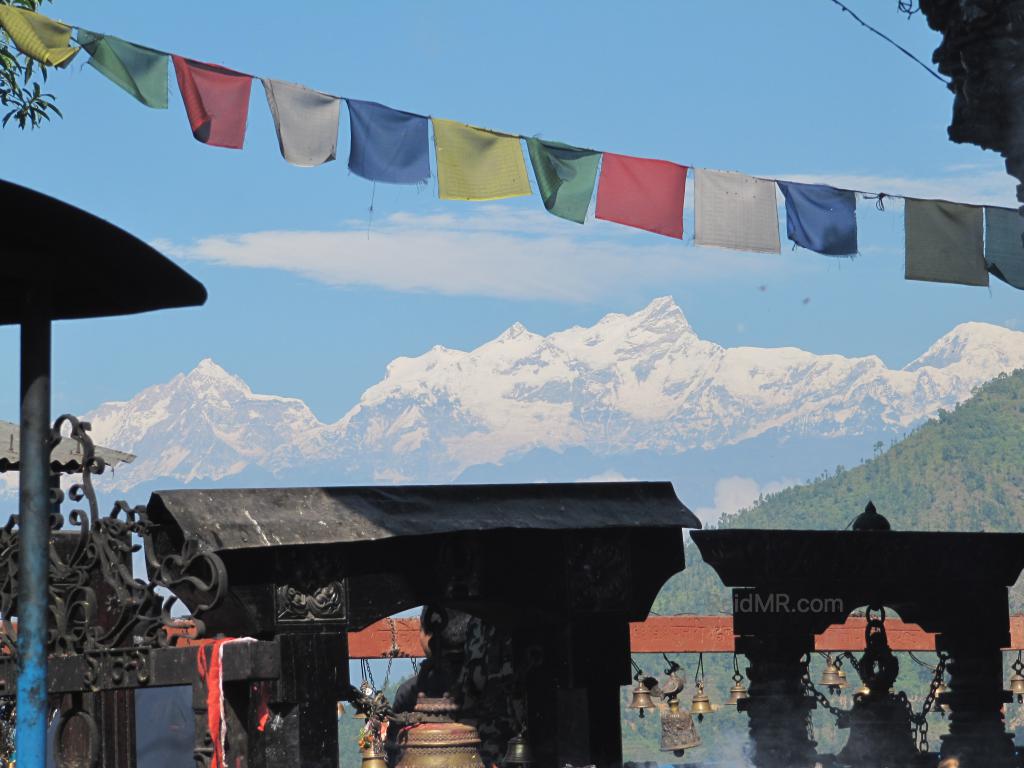 Manakamana Temple, with Himalayan Mountains and prayer flags. 