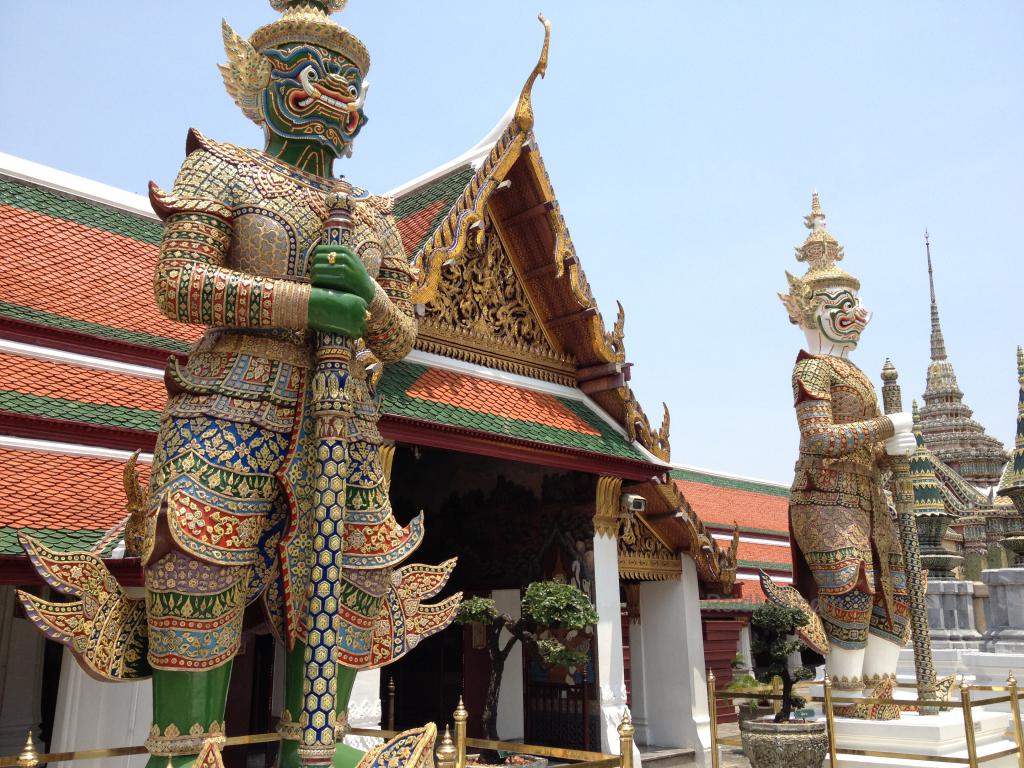 Some of the statues at the Temple of the Emerald Buddha, large ones in the protector/guard position at a doorway