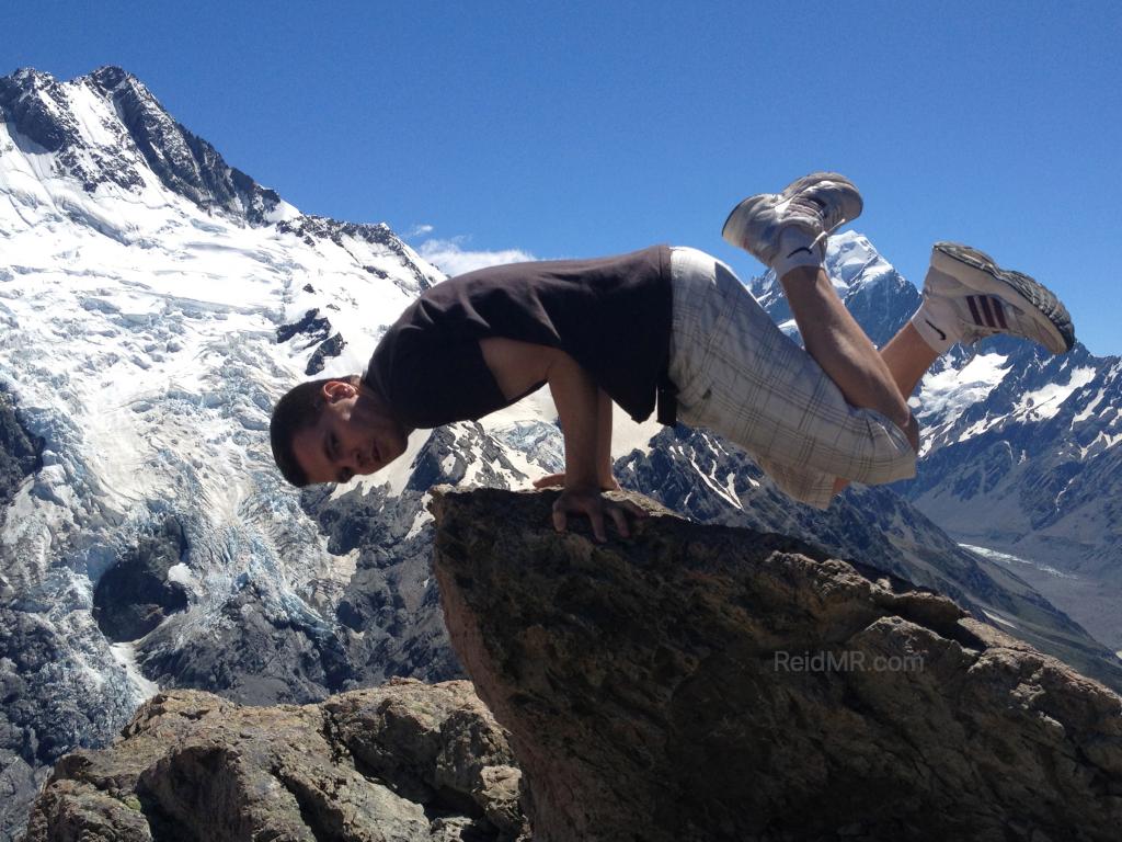 Me doing an elbow lever with Mount Cook and glaciers in the background.