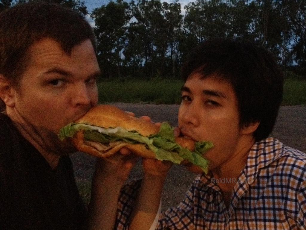 Ben and I eating a sub sandwich in a weird way.